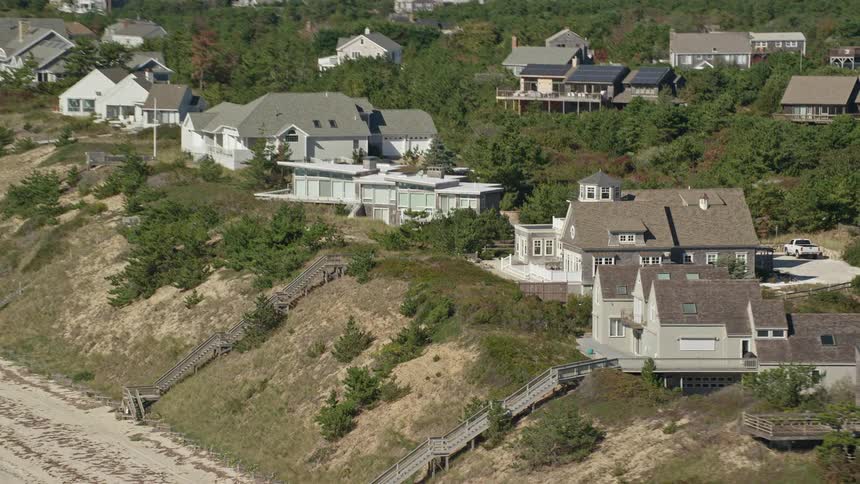 Aerial view of coastal homes on cliff