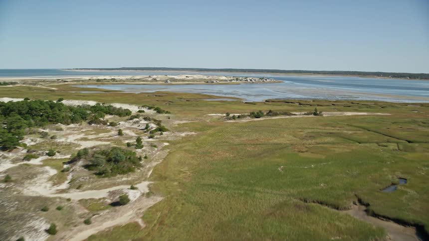Flight over tidal pools at the sea shore in a coastal region