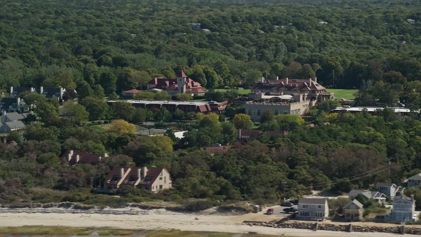 The estate is behind the homes on the shore