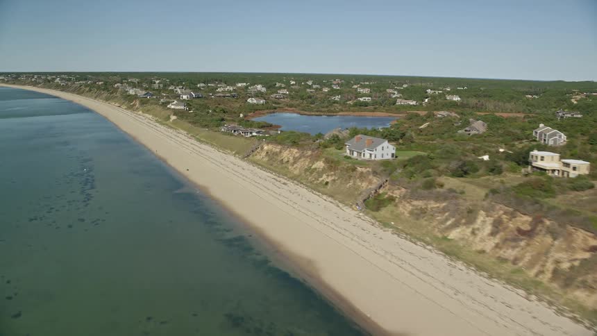 Aerial drone view of houses on a coastal town