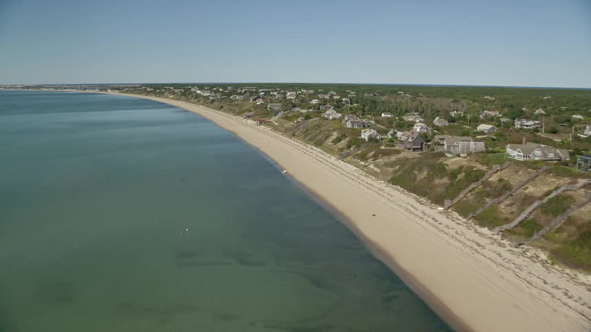 Homes are on a hill by the beach