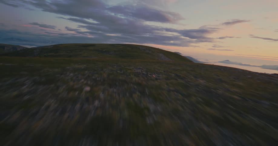 Aerial drone view of hills slopes at sunset