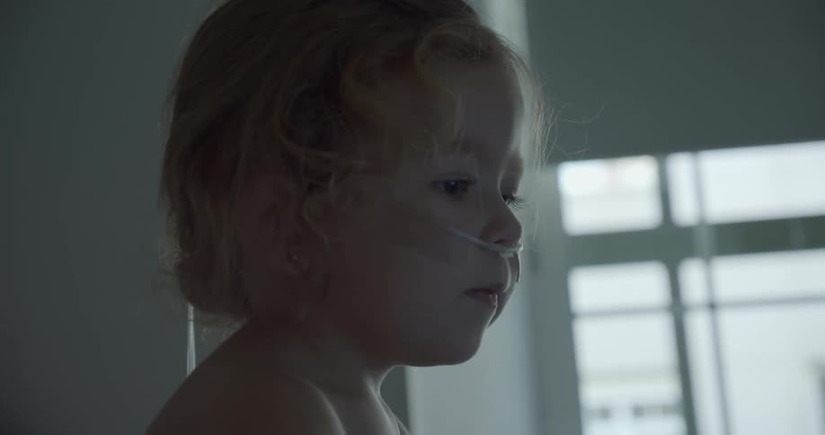 Girl wearing a nasal cannula in the hospital