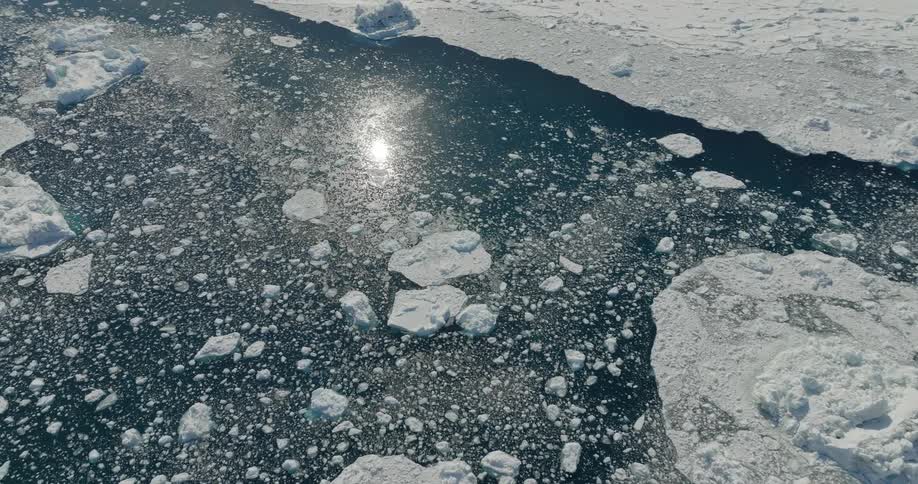 The water has ice by the shore