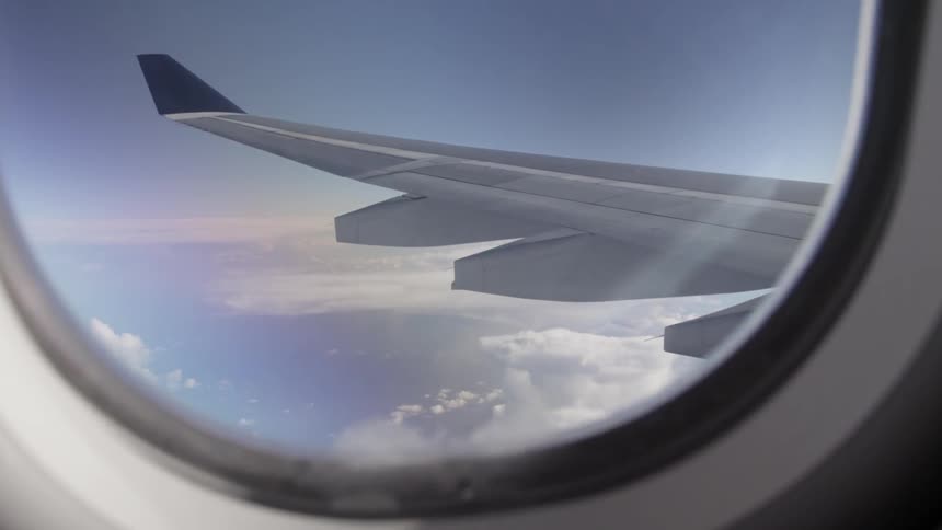 The plane is flying high above the clouds
