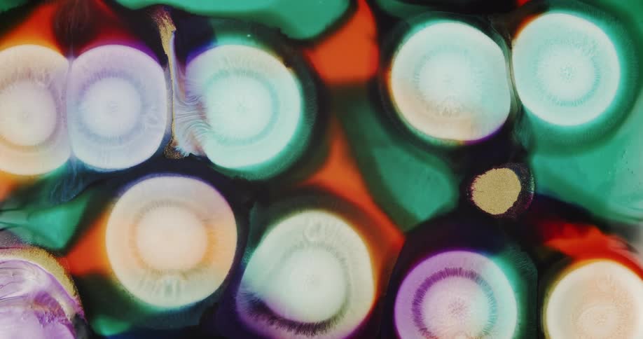 Background of expanding abstract circles of liquid inks