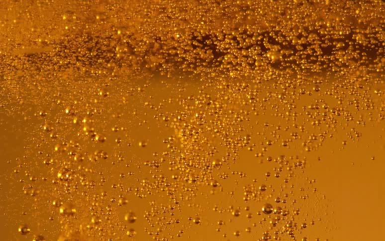 Gasified liquid with bubbles moving in slow motion