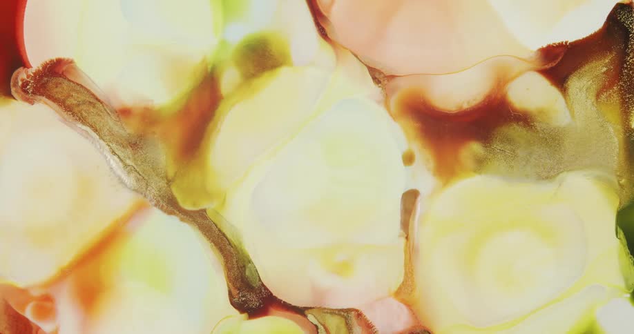 Colorful abstract liquid ink background with golden particles