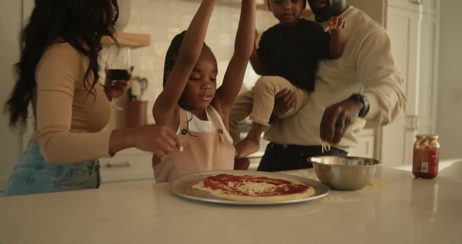 Family preparing a homemade cheese pizza