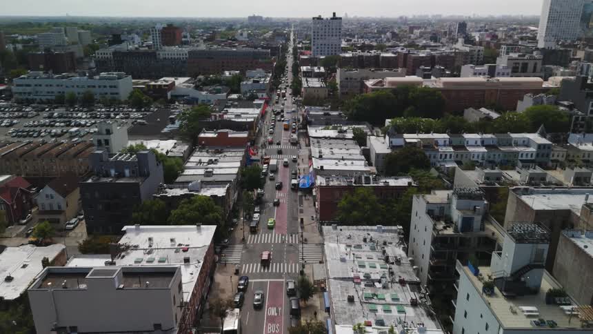 Aerial of urban city with busy avenue