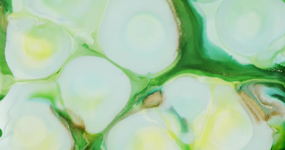 Moving abstract liquid ink shapes with gold background