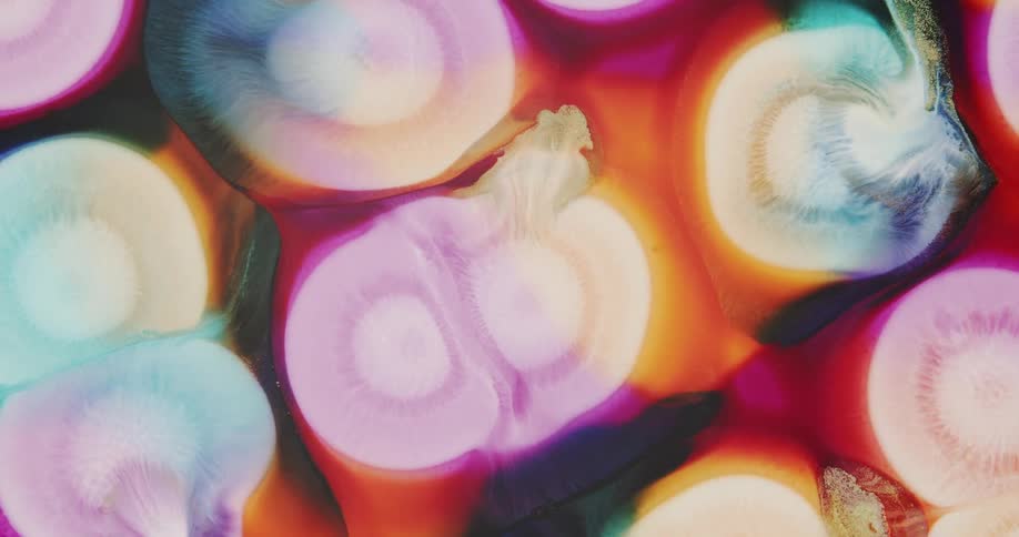 Background of expanding abstract circles of liquid inks