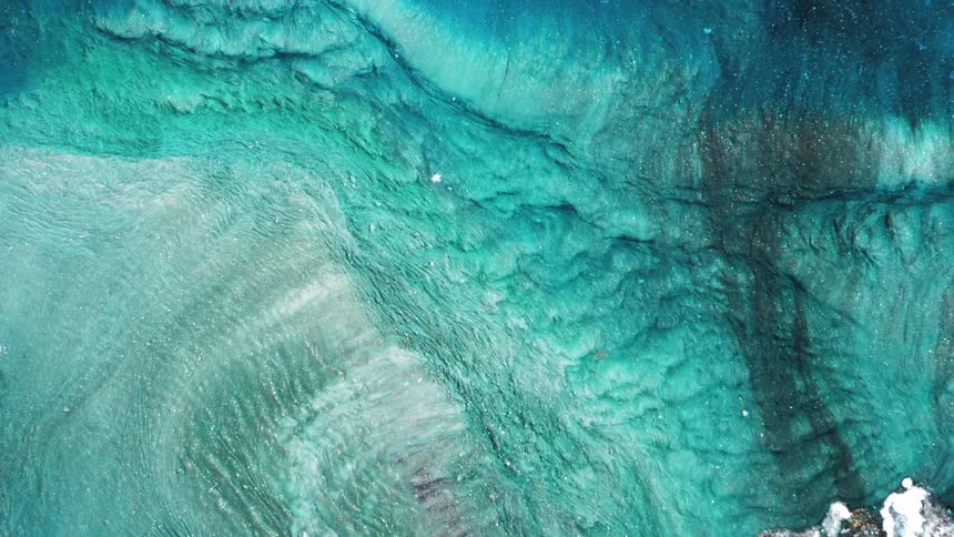 Abstract display of light blue liquid in motion