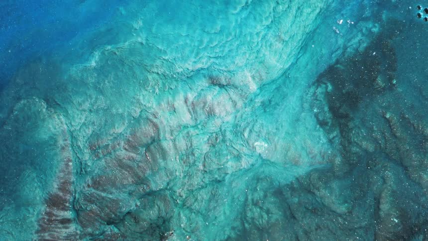 Dense bright blue abstract liquid in a sea current motion