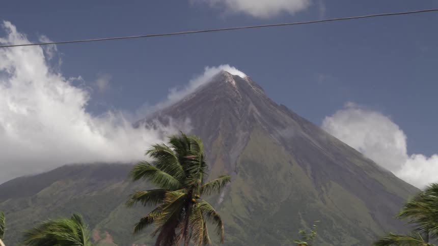 Mountain with clouds outside cars windows view