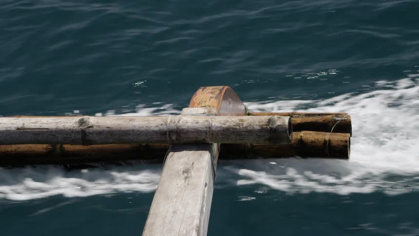 Wooden raft flowing through water