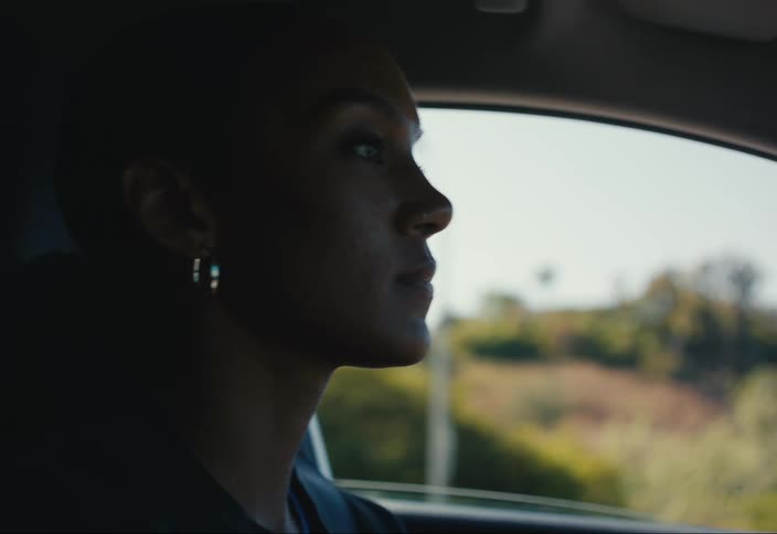 Woman driving along a road