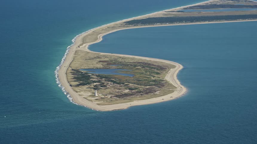 Lighthouse sits at one end of small island containing multiple lakes