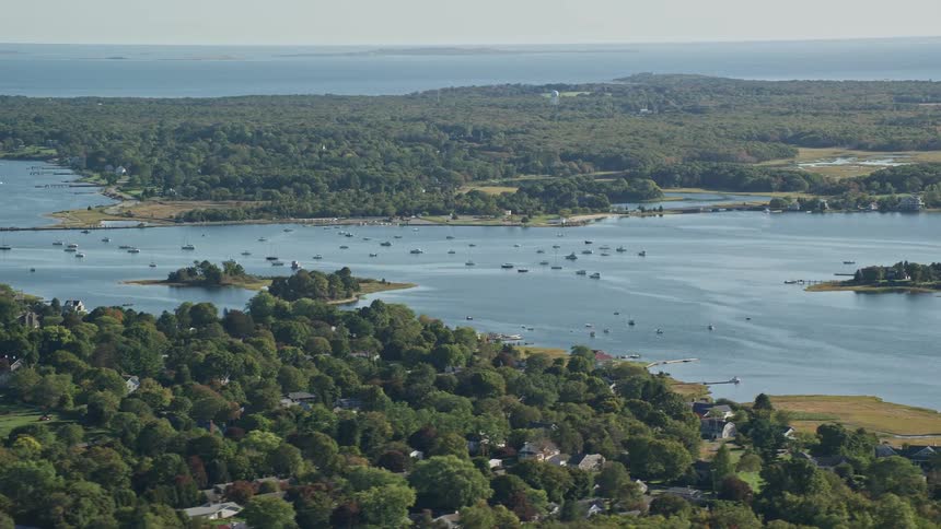 Aerial panorama of a natural area with residential houses by the seaside