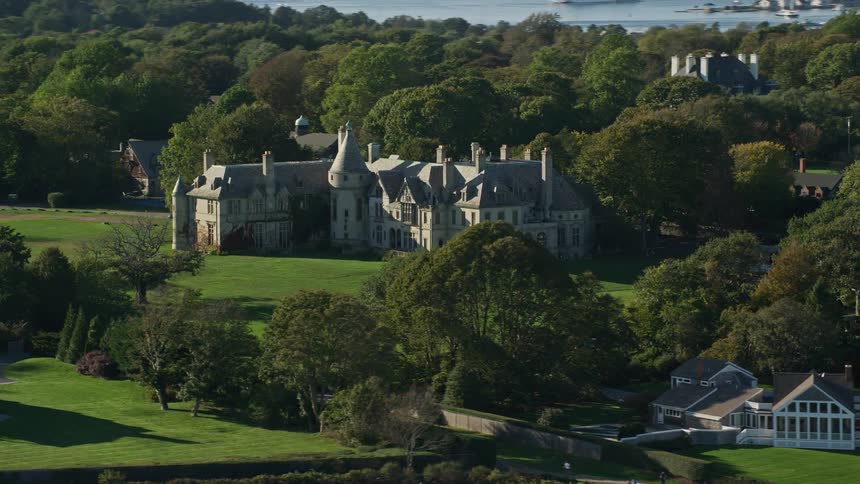 Aerial panorama of mansions in green surroundings by the seaside