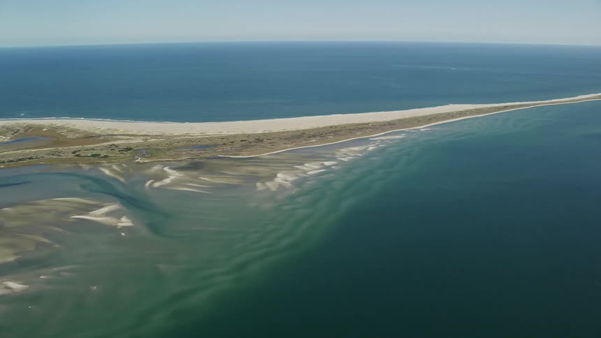 Aerial view of long sandy beach on island