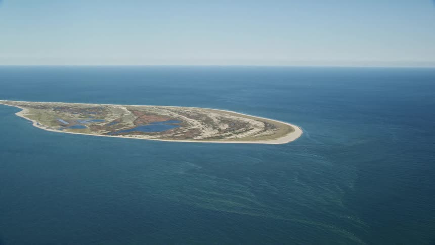 Aerial view of the iconic great point light stands tall against the picturesque backdrop of nantucket island massachusetts
