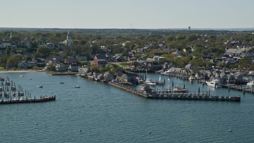 Aerial panorama of a seaside city with docks for boat and yachts