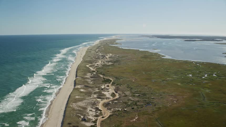 A beach on an island that faces a large ocean