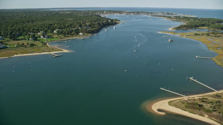 Aerial panorama of a central lake with multiple boats and docks