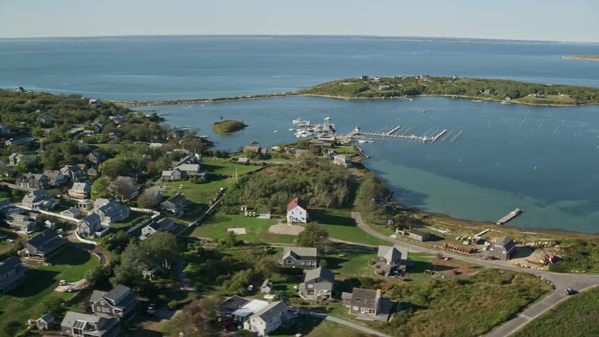 The small town on the shore has docks for boats