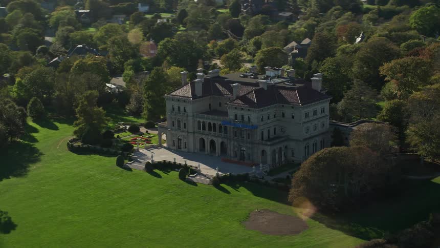 Aerial view of a country manor surrounded by gardens