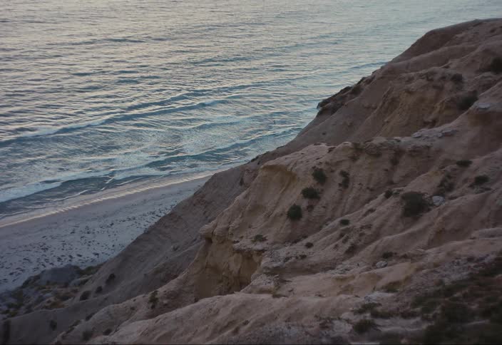 View of the coastline and the sea with calm waves