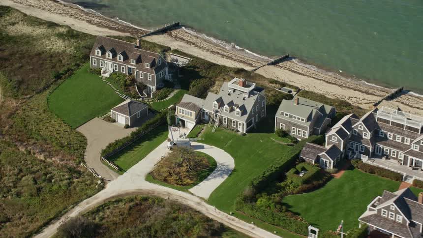 Aerial view of upscale beachfront homes in nantucket massachusetts with a tiltdown angle