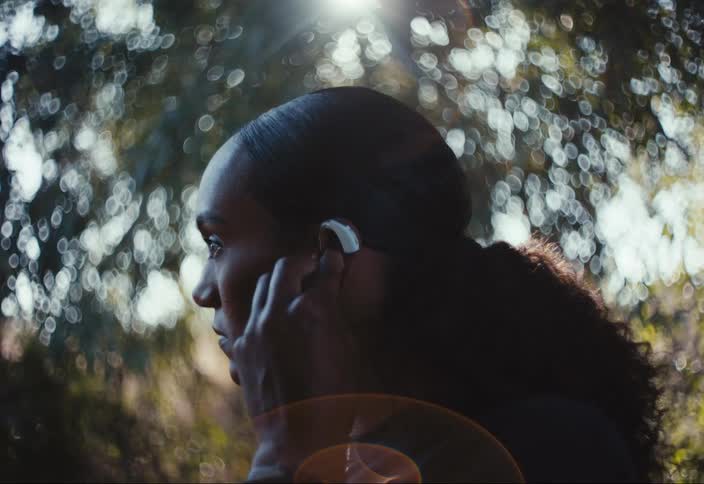 Woman wearing hearing aids outdoors