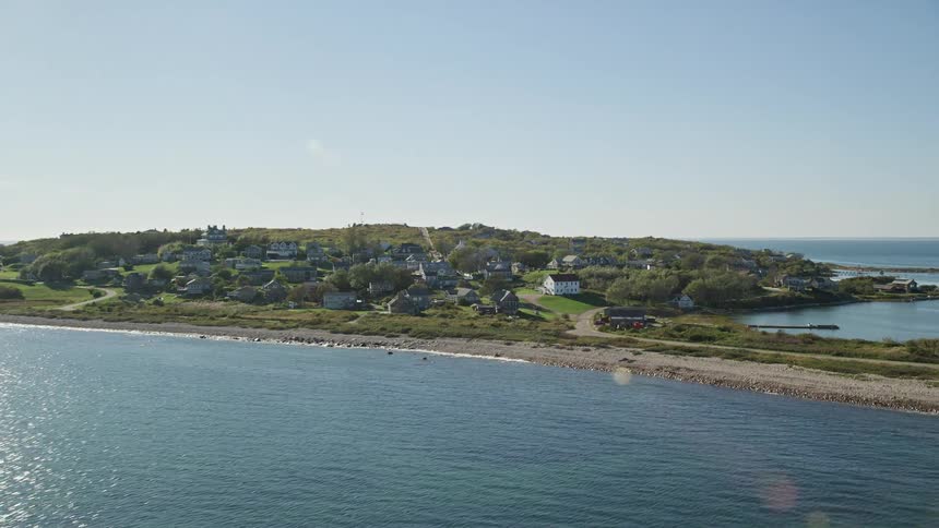 Aerial panorama of the sea and an island with a residential neighborhood