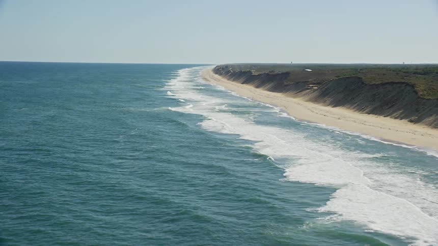 Panorama of a long stretch of sea sand on a natural beach