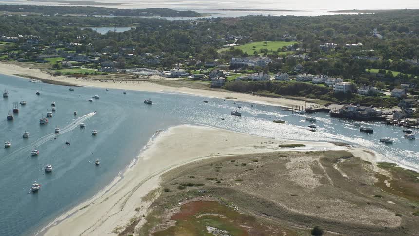 Aerial panorama of a city with mansions and hotels by the sea with boats and yachts