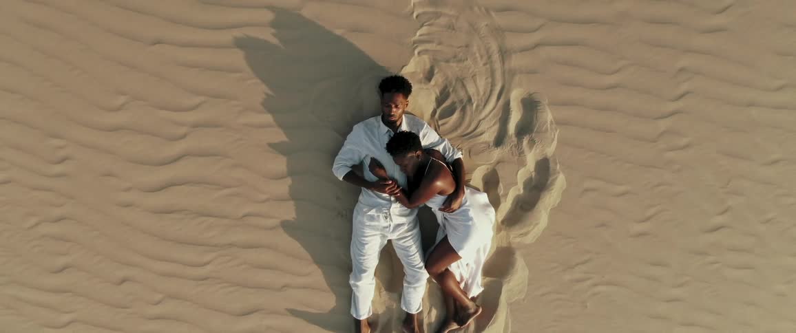 A couple hug in the desert