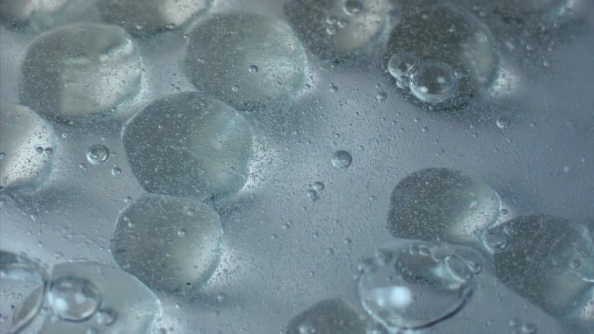 A surface of a liquid that is bubbling