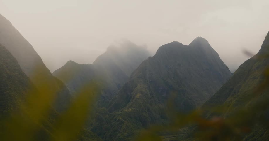 The mountains are covered with heavy fog