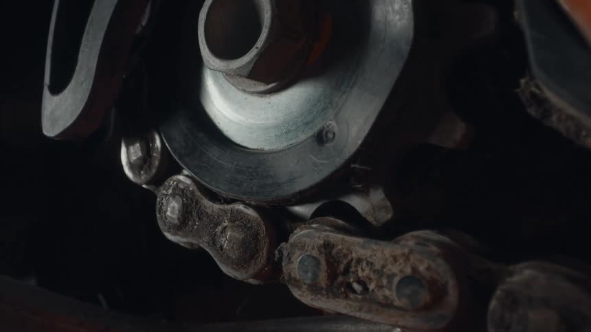 The chain spins around the wheel