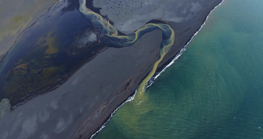 The ocean runs into a river on the land