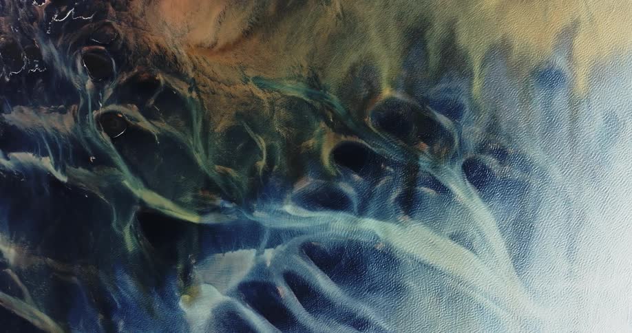 Glacier rivers with various shades of blue and yellow colors