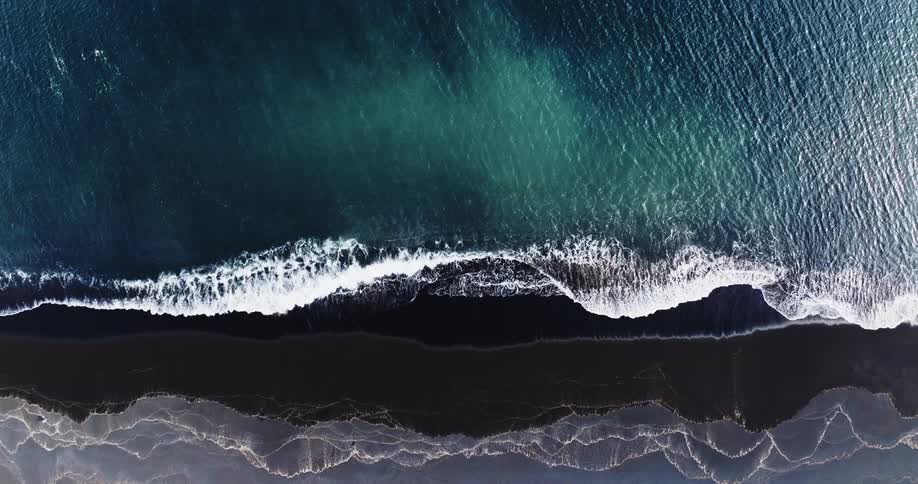 Waves are crashing against the shore