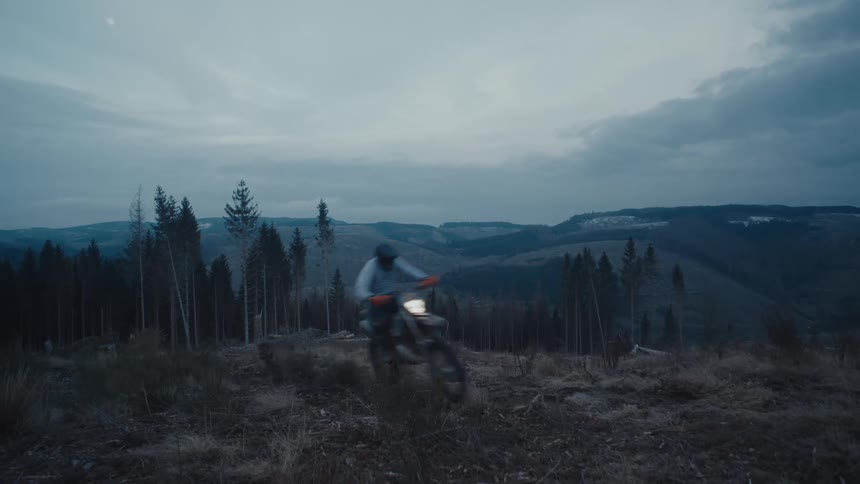 Man drives a motocross motorcycle on the mountains
