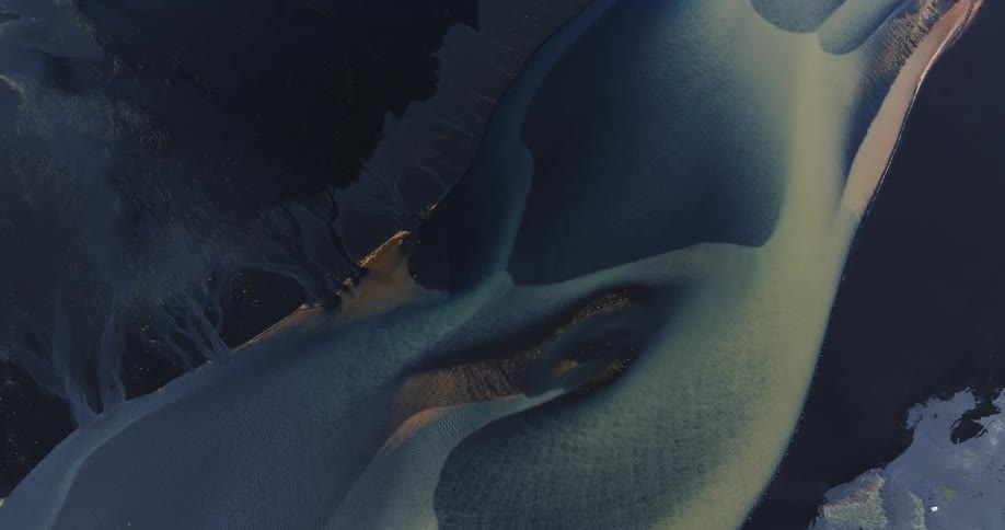 Aerial view of rivers meeting the ocean