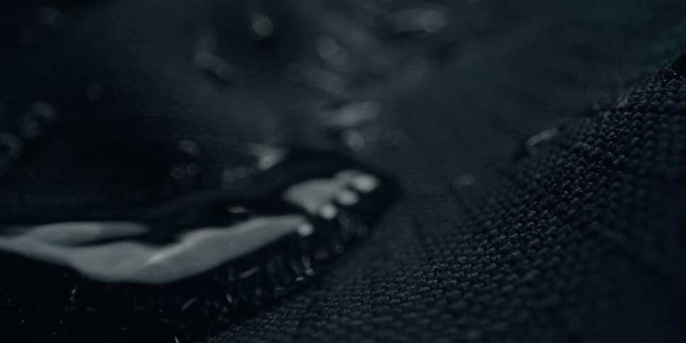 Water flowing over black cloth