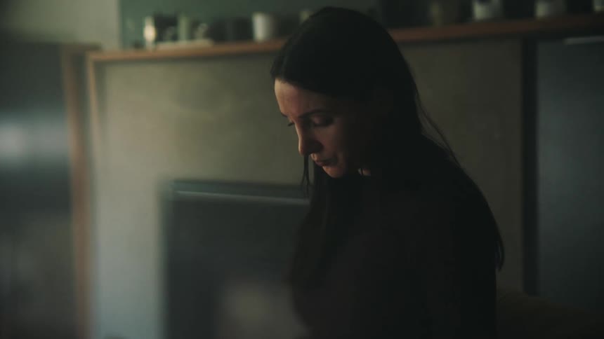 A woman is worried in the room