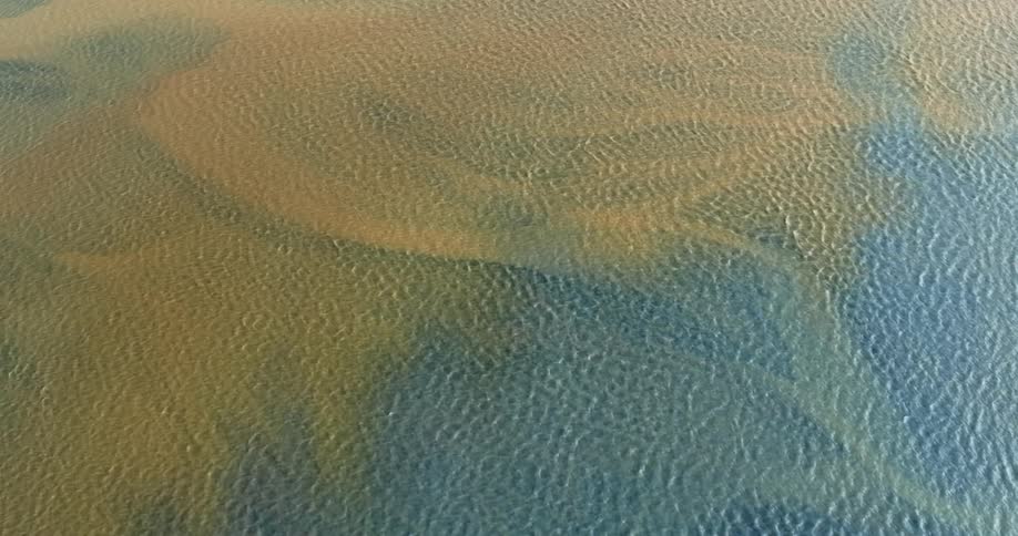 Aerial view of rivers with blue and yellow color
