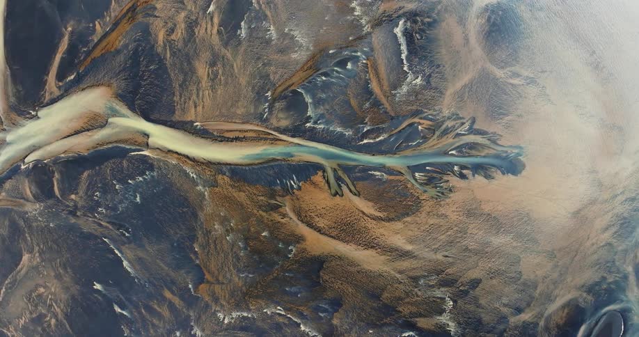 Glacier rivers with various shades of blue and yellow colors